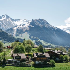 Swiss village on beautiful mountains background Swiss village on beautiful mountains background